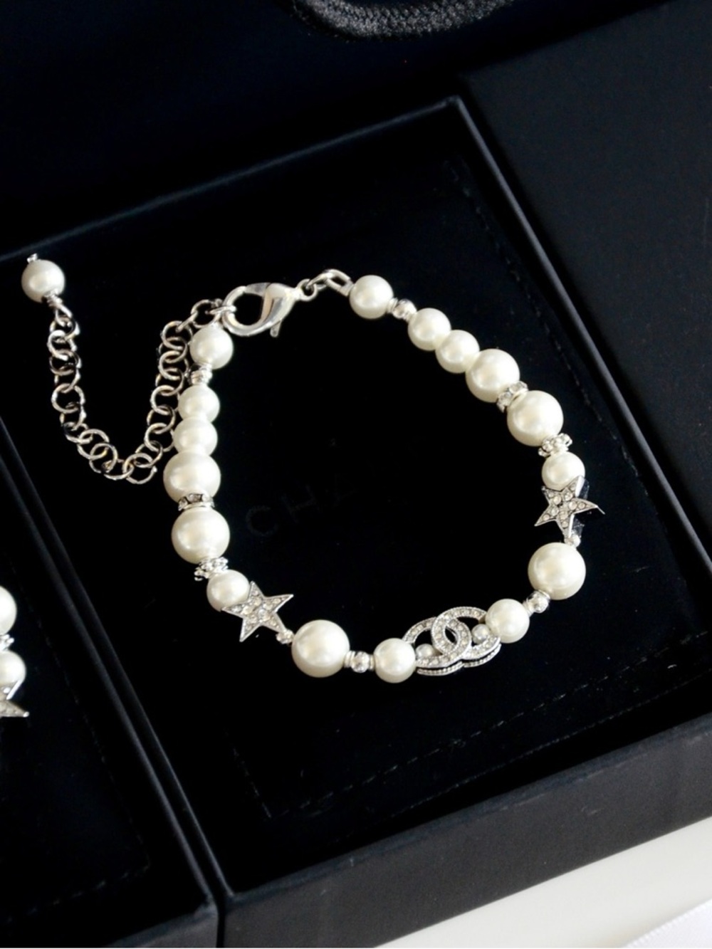 CHANEL Pearl Bracelet with Crystal CC Logo and Star Accents in White and Silver